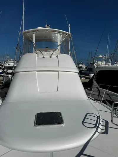  Yacht Photos Pics 2006 Tiara Yachts 3900 Convertible at marina, clear sky background.