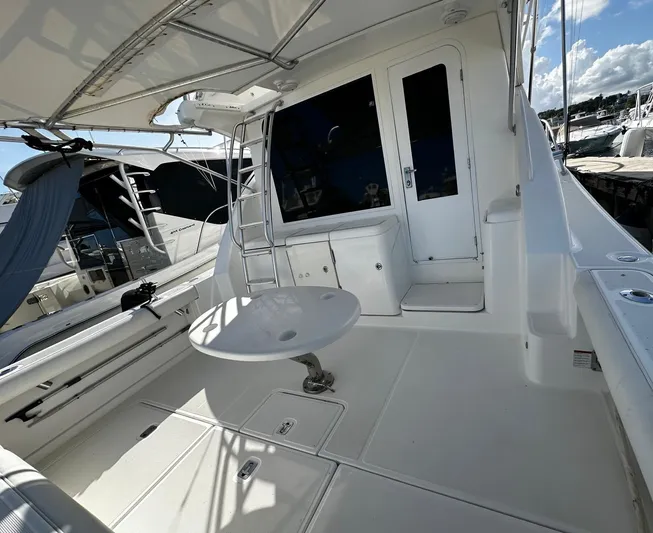  Yacht Photos Pics 2006 Tiara Yachts 3900 Convertible boat deck with seating and ladder.