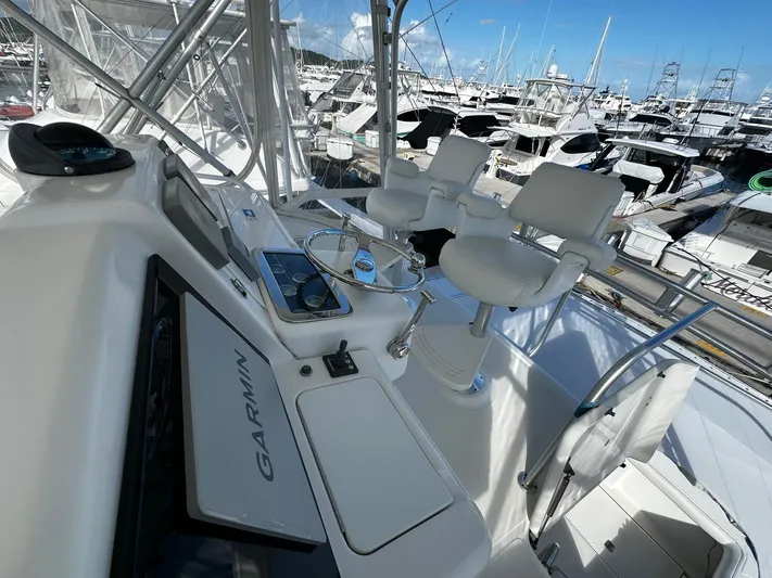  Yacht Photos Pics 2006 Tiara Yachts 3900 Convertible helm with Garmin navigation, docked in marina.