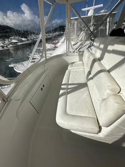  Yacht Photos Pics Interior view of 2006 Tiara Yachts 3900 Convertible with white seating and marina backdrop.