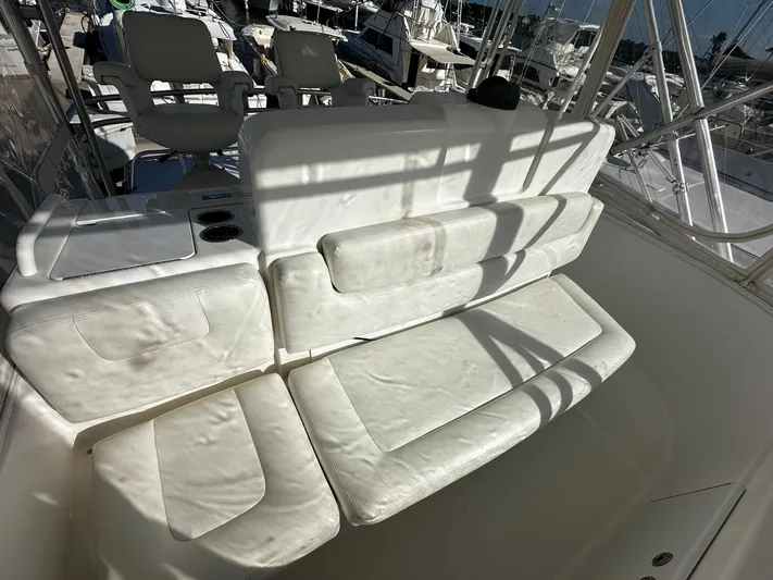  Yacht Photos Pics 2006 Tiara Yachts 3900 Convertible, white seating area on deck, marina background.