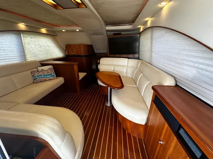  Yacht Photos Pics Luxurious 2006 Tiara Yachts 3900 Convertible interior with elegant seating and wood finishes.