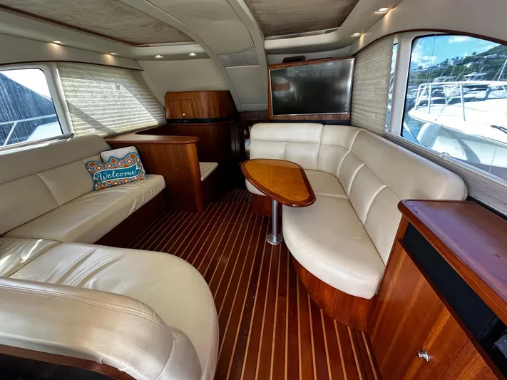  Yacht Photos Pics Luxurious interior of 2006 Tiara Yachts 3900 Convertible with leather seating and wood accents.