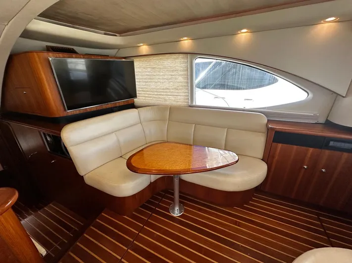  Yacht Photos Pics 2006 Tiara Yachts 3900 Convertible interior with leather seating and wooden table.