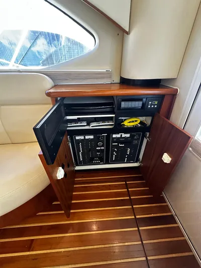  Yacht Photos Pics 2006 Tiara Yachts 3900 Convertible interior with open cabinet and control panel.