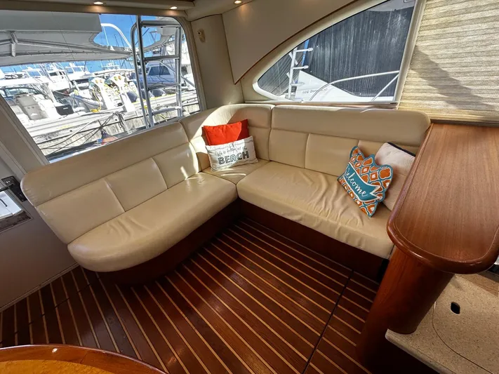  Yacht Photos Pics Luxurious 2006 Tiara Yachts 3900 Convertible interior with leather seating and nautical decor.