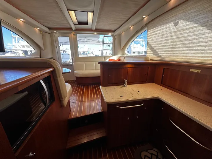  Yacht Photos Pics Luxurious interior of 2006 Tiara Yachts 3900 Convertible with wood finishes and modern amenities.