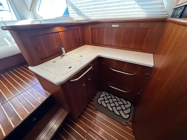  Yacht Photos Pics 2006 Tiara Yachts 3900 Convertible interior with wooden cabinetry and countertop.