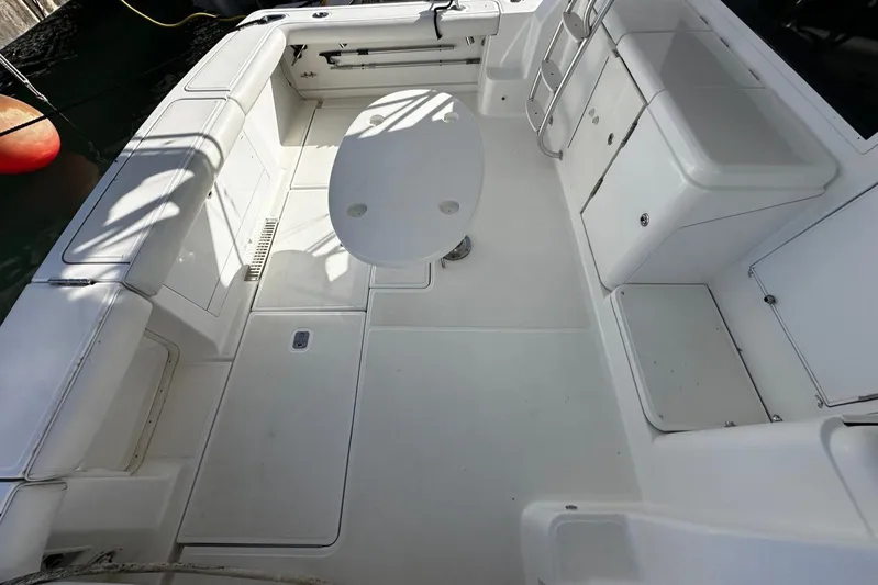  Yacht Photos Pics 2006 Tiara Yachts 3900 Convertible boat deck with seating and table.