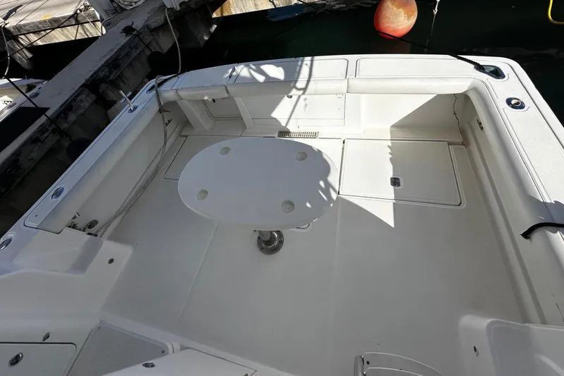  Yacht Photos Pics 2006 Tiara Yachts 3900 Convertible boat deck with table, docked in marina.