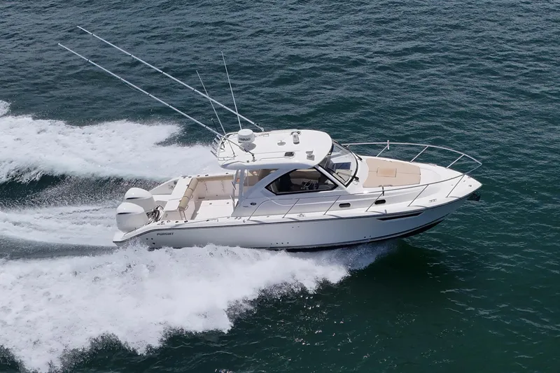 Cay Day Yacht Photos Pics 2017 Pursuit 325 OS boat cruising on open water, showcasing sleek design and powerful engines.