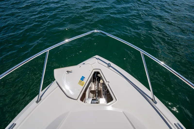 Cay Day Yacht Photos Pics Bow view of 2017 Pursuit 325 OS boat on open water.