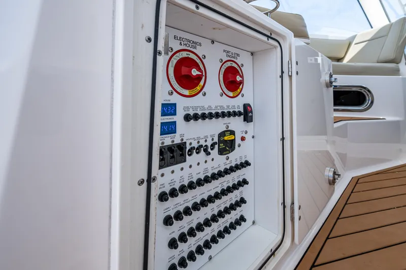 Cay Day Yacht Photos Pics Electrical panel on a 2017 Pursuit 325 OS boat, featuring switches and controls.