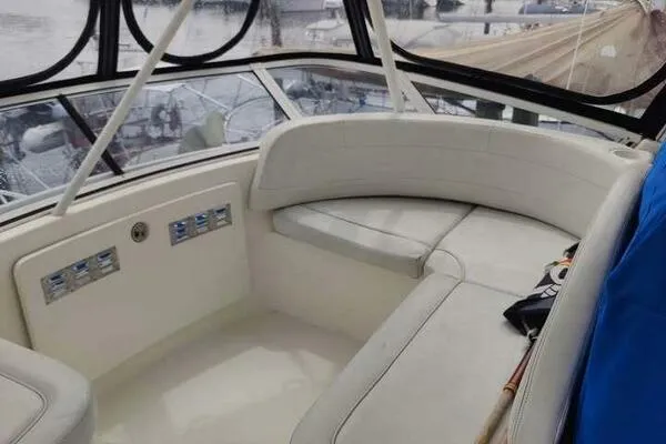  Yacht Photos Pics 2001 Silverton 42 Convertible yacht interior with white seating and panoramic windows.