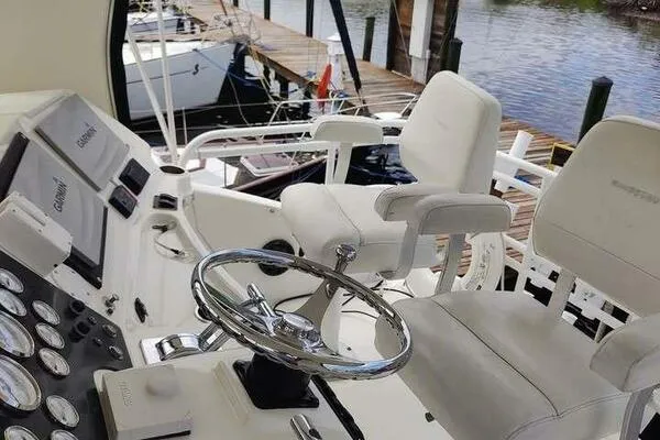  Yacht Photos Pics 2001 Silverton 42 Convertible yacht helm with steering wheel and control panels.