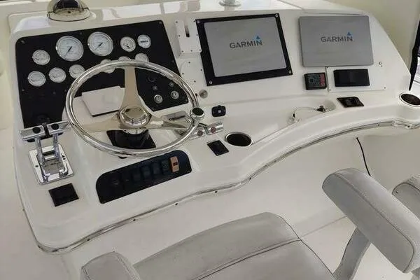  Yacht Photos Pics 2001 Silverton 42 Convertible helm with Garmin navigation displays and steering wheel.