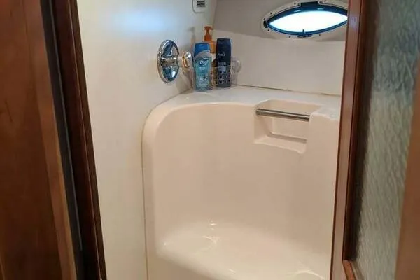  Yacht Photos Pics Bathroom interior of 2001 Silverton 42 Convertible yacht with shower amenities.