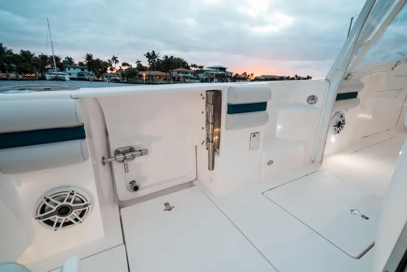  Yacht Photos Pics 2021 Intrepid 409 Valor boat interior at sunset, featuring sleek white design and modern amenities.