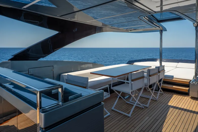 Coco Y Yacht Photos Pics Luxurious 2025 Riva 82' Diva yacht deck with elegant seating and ocean view.