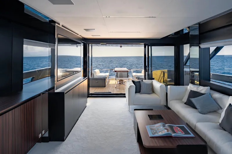 Coco Y Yacht Photos Pics Luxurious interior of 2025 Riva 82' Diva yacht with ocean view and modern decor.