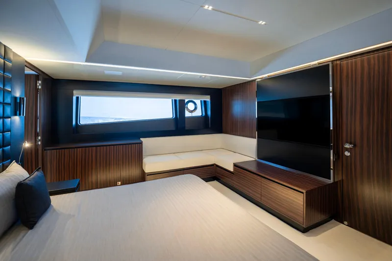 Coco Y Yacht Photos Pics Luxurious interior of 2025 Riva 82' Diva yacht with modern wood finishes.