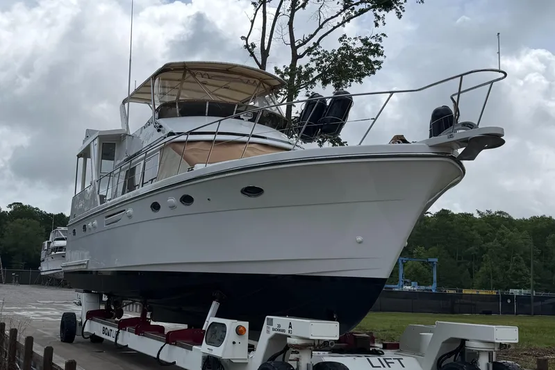 Adagio Yacht Photos Pics 2005 Jefferson Rivanna 50 SDMY yacht on lift, cloudy sky background.