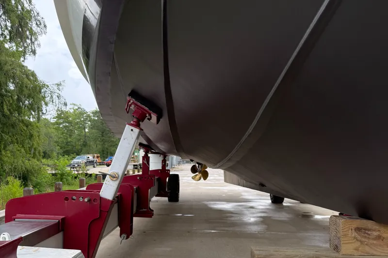 Adagio Yacht Photos Pics 2005 Jefferson Rivanna 50 SDMY yacht on trailer, viewed from below, with visible propeller.