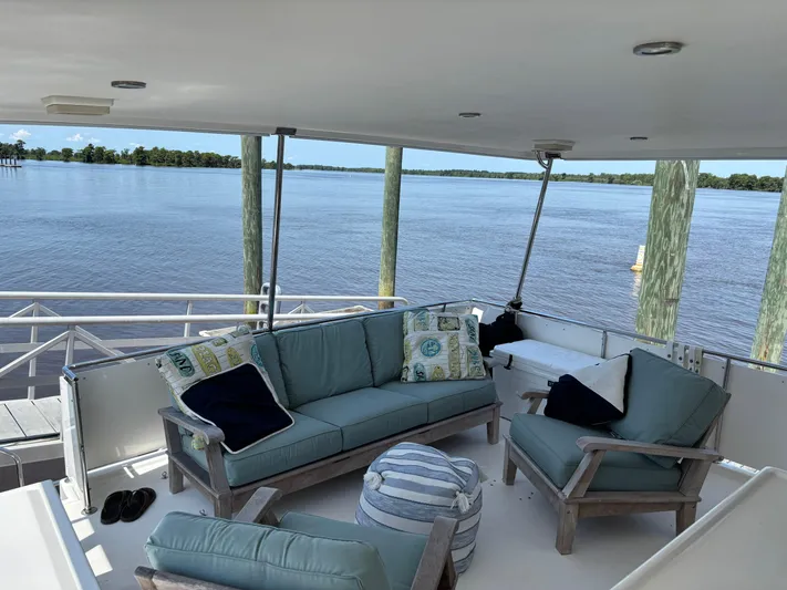 Adagio Yacht Photos Pics Spacious deck of 2005 Jefferson Rivanna 50 SDMY with comfortable seating and scenic water view.