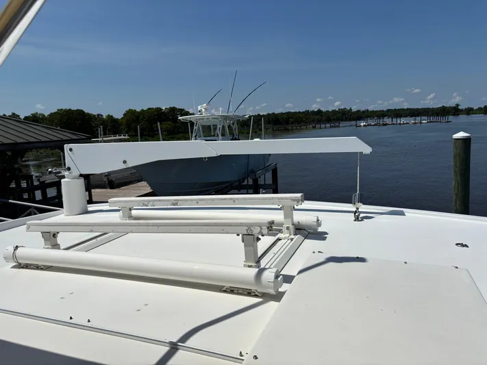 Adagio Yacht Photos Pics 2005 Jefferson Rivanna 50 SDMY yacht docked by a serene waterfront.