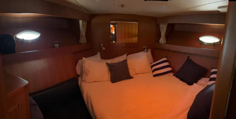 Adagio Yacht Photos Pics Luxurious cabin interior of 2005 Jefferson Rivanna 50 SDMY yacht with cozy bedding.