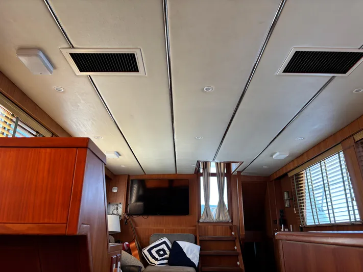 Adagio Yacht Photos Pics Interior of 2005 Jefferson Rivanna 50 SDMY yacht with wood paneling and modern furnishings.