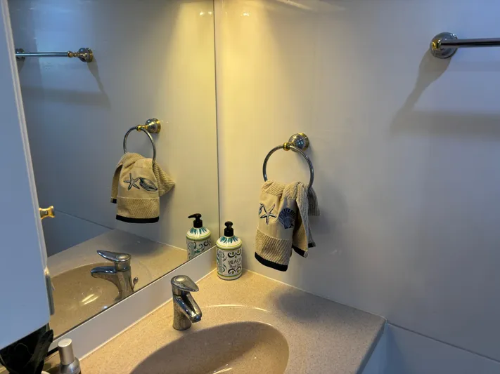 Adagio Yacht Photos Pics Bathroom vanity with towel and soap dispensers on Jefferson Rivanna 50 SDMY, 2005 model.