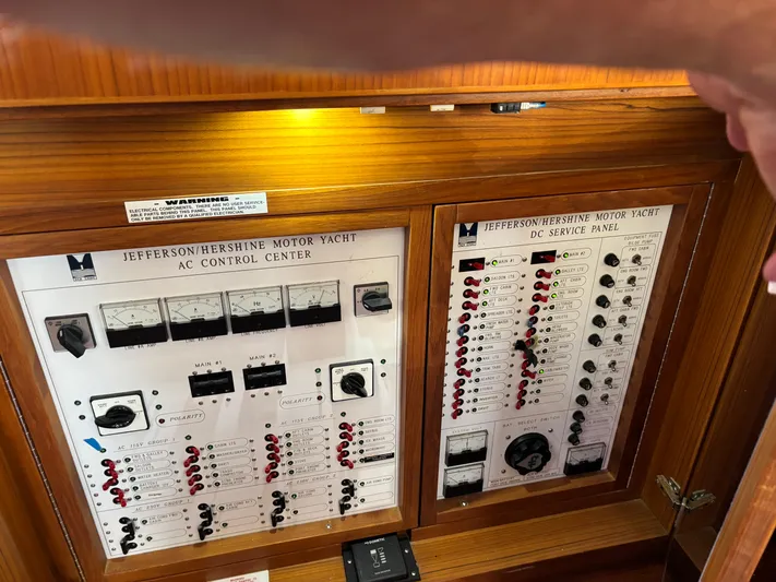 Adagio Yacht Photos Pics Control panels of a 2005 Jefferson Rivanna 50 SDMY yacht, featuring AC and DC systems.