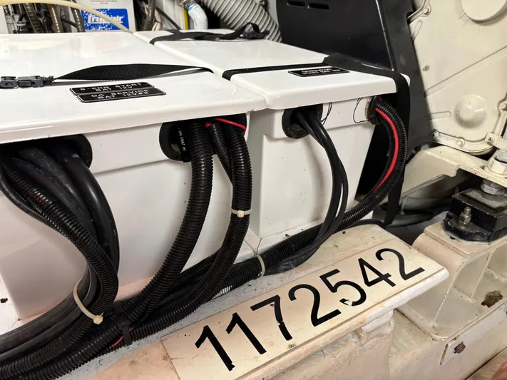 Adagio Yacht Photos Pics Engine compartment of a 2005 Jefferson Rivanna 50 SDMY with visible wiring and serial number.