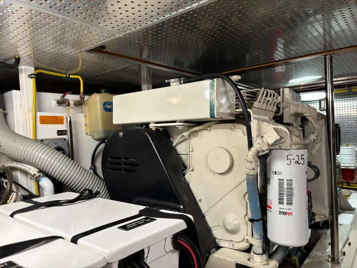 Adagio Yacht Photos Pics Engine room of 2005 Jefferson Rivanna 50 SDMY yacht, showcasing mechanical components and systems.