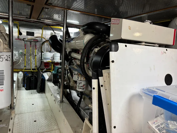 Adagio Yacht Photos Pics Engine room of a 2005 Jefferson Rivanna 50 SDMY yacht, showcasing machinery and equipment.
