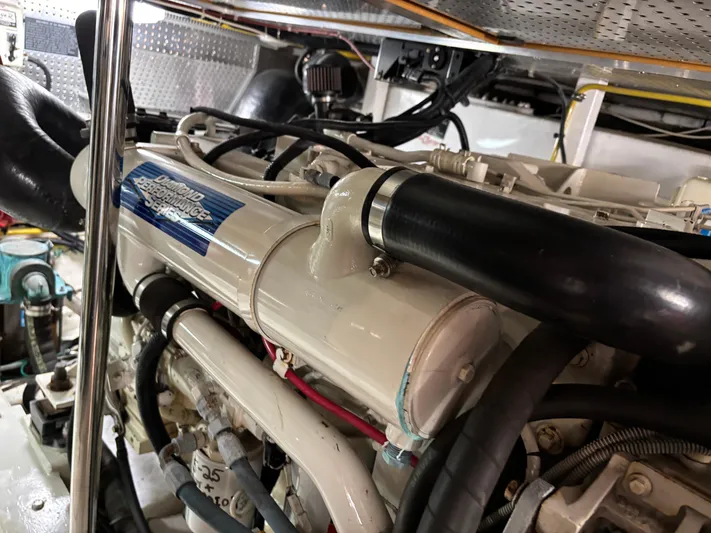 Adagio Yacht Photos Pics Engine room of a 2005 Jefferson Rivanna 50 SDMY yacht, featuring a Diamond Performance Series engine.