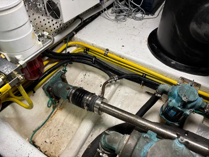 Adagio Yacht Photos Pics Engine room of 2005 Jefferson Rivanna 50 SDMY with visible mechanical components and wiring.