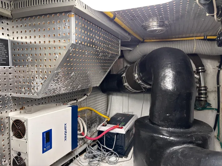 Adagio Yacht Photos Pics Engine room of 2005 Jefferson Rivanna 50 SDMY with ventilation and electrical systems.