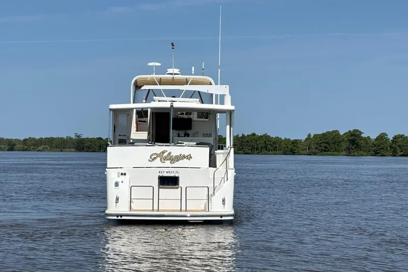 Adagio Yacht Photos Pics 2005 Jefferson Rivanna 50 SDMY yacht on calm water, rear view.