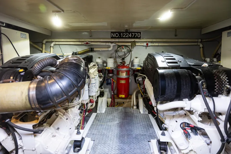  Yacht Photos Pics Engine room of 2008 Marquis 50 LS yacht, featuring dual engines and mechanical equipment.