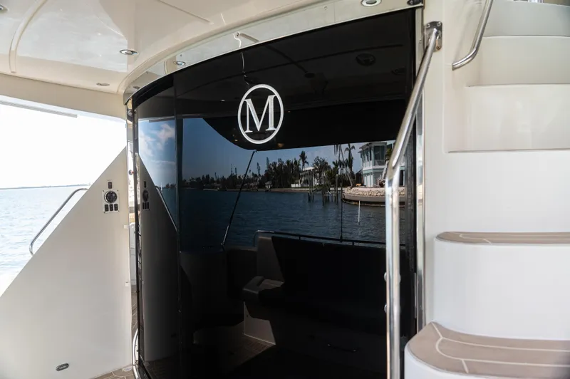  Yacht Photos Pics Luxury Marquis 50 LS yacht interior, 2008 model, with sleek black glass and elegant staircase.
