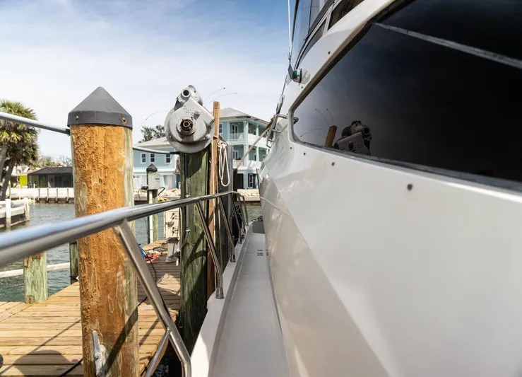  Yacht Photos Pics Side view of 2008 Marquis 50 LS yacht docked at a marina.