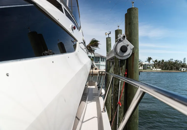  Yacht Photos Pics 2008 Marquis 50 LS yacht docked by the water on a sunny day.