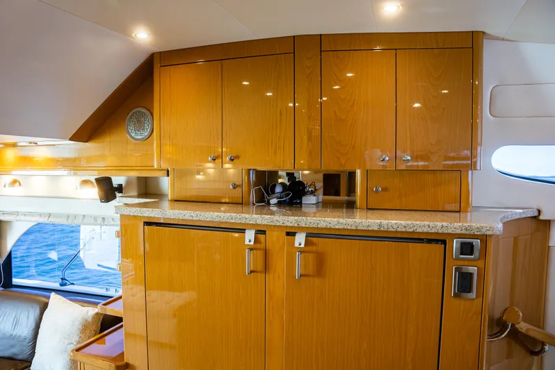  Yacht Photos Pics Luxurious interior of 2008 Marquis 50 LS yacht with wooden cabinetry and modern lighting.