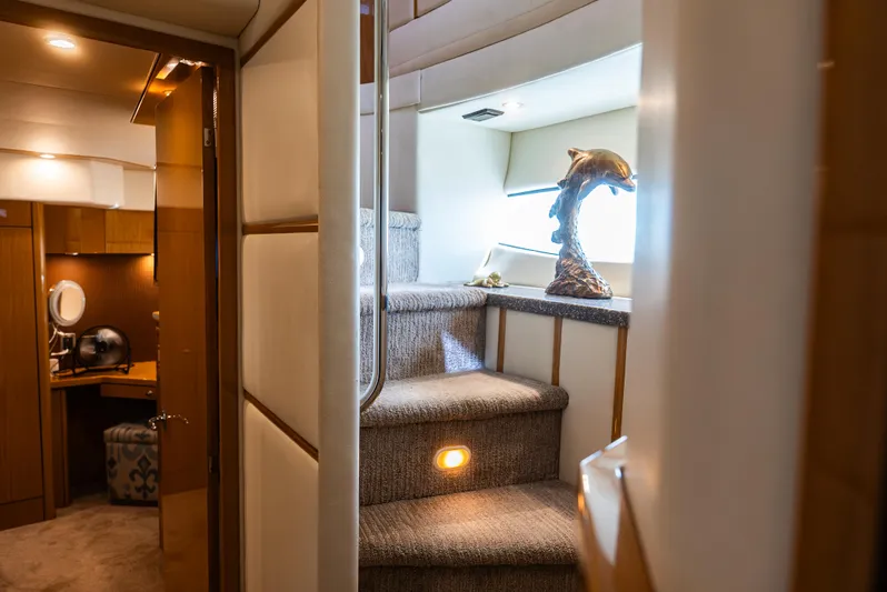  Yacht Photos Pics Luxurious interior of 2008 Marquis 50 LS yacht with elegant staircase and decor.