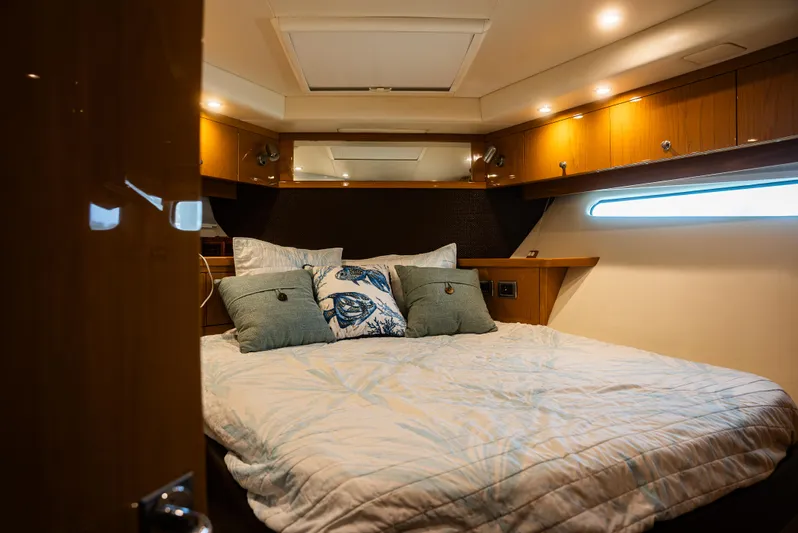  Yacht Photos Pics Luxurious bedroom interior of 2008 Marquis 50 LS yacht with cozy bedding.