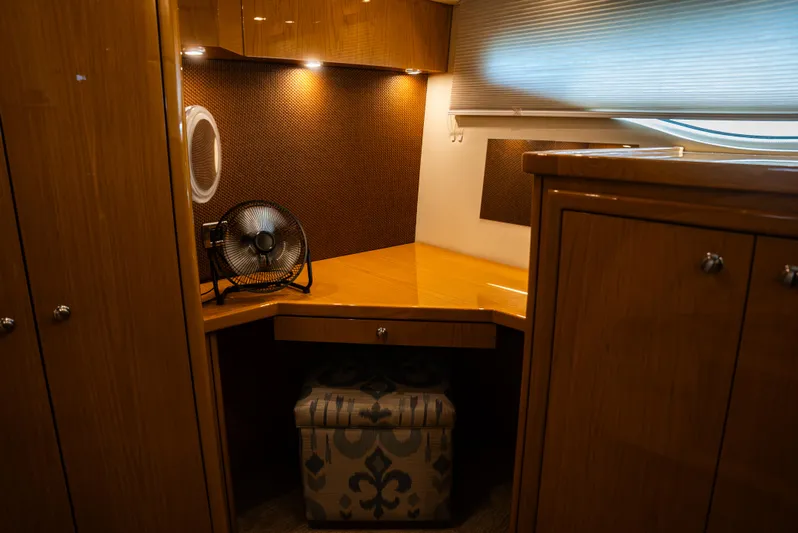  Yacht Photos Pics Interior of 2008 Marquis 50 LS yacht with wooden cabinetry and small fan on desk.