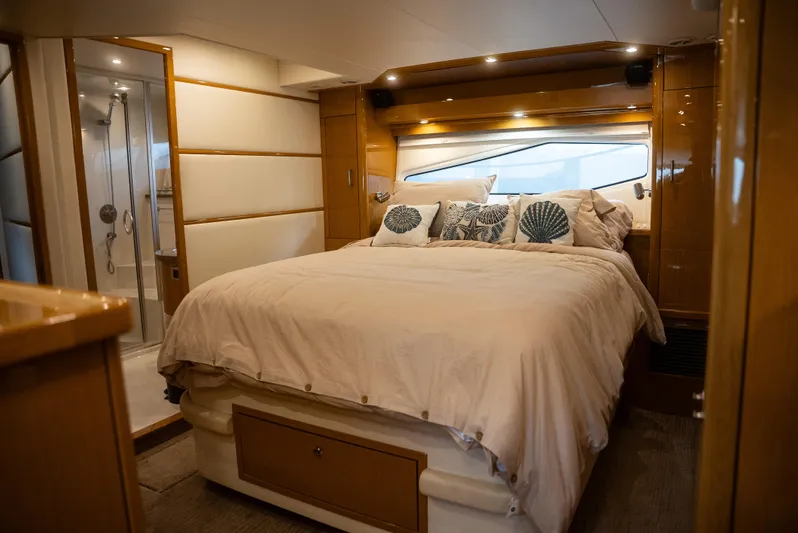  Yacht Photos Pics Luxurious bedroom interior of 2008 Marquis 50 LS yacht with elegant bedding and modern design.