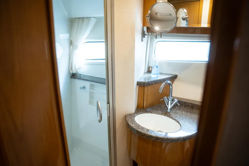  Yacht Photos Pics Luxurious bathroom in 2008 Marquis 50 LS yacht with modern fixtures and elegant design.